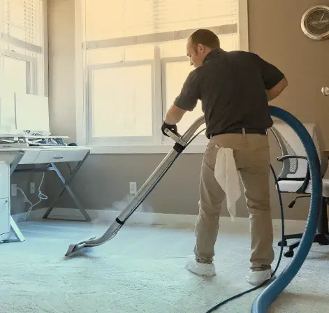 Steam cleaning carpet in Dallas home — Essential Clean package